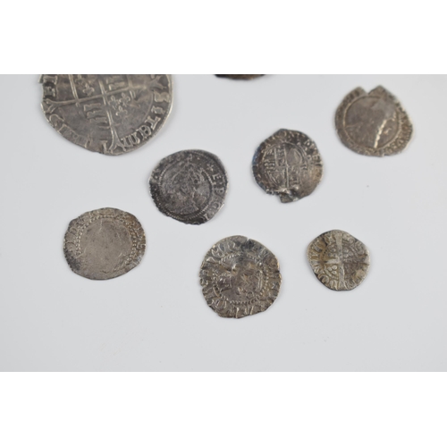 280A - An interesting collection of hammered silver coins of varying sizes and denominations to include Eli... 