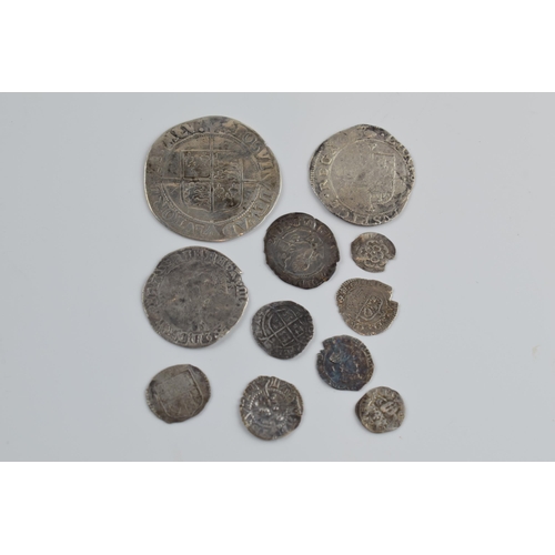 280A - An interesting collection of hammered silver coins of varying sizes and denominations to include Eli... 