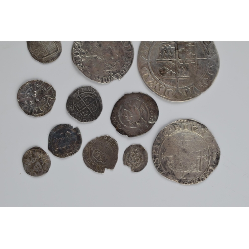 280A - An interesting collection of hammered silver coins of varying sizes and denominations to include Eli... 