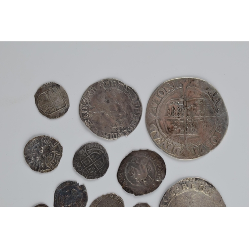 280A - An interesting collection of hammered silver coins of varying sizes and denominations to include Eli... 