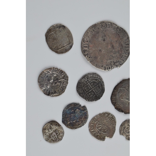 280A - An interesting collection of hammered silver coins of varying sizes and denominations to include Eli... 