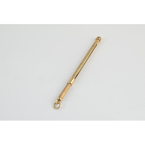 381A - 9ct gold mechanical cocktail stirrer / swizzle stick, 12.5cm extended, 5.0 grams gross weight.