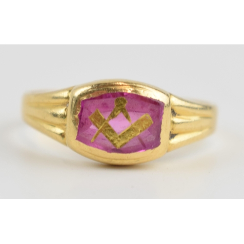 416B - 18ct gold ring set with a ruby with inlaid gold decoration with Masonic logo, 3.3 grams, size O/P.