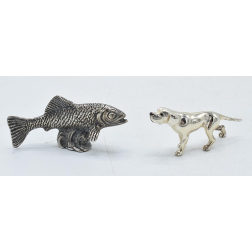 201 - A pair of silver miniature figures of a fish and a dog, combined weight 19 grams (2), tallest 2 cm.