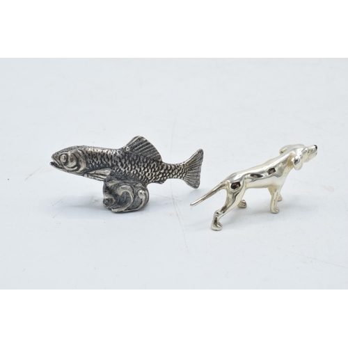 201 - A pair of silver miniature figures of a fish and a dog, combined weight 19 grams (2), tallest 2 cm.