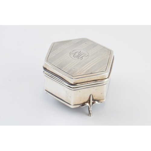 310A - Silver hexagonal trinket box, raised on three feet, with silk interior, Birmingham 1914, 6cm wide.