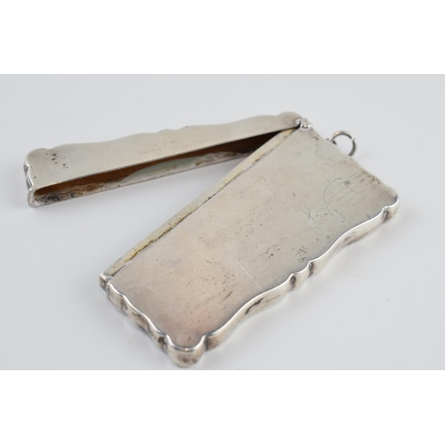 310J - Silver card case with hinged lid with musical notes decoration, Birmingham 1932, 50.4 grams, 9cm wid... 