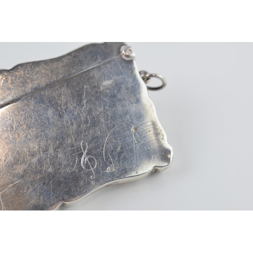 310J - Silver card case with hinged lid with musical notes decoration, Birmingham 1932, 50.4 grams, 9cm wid... 