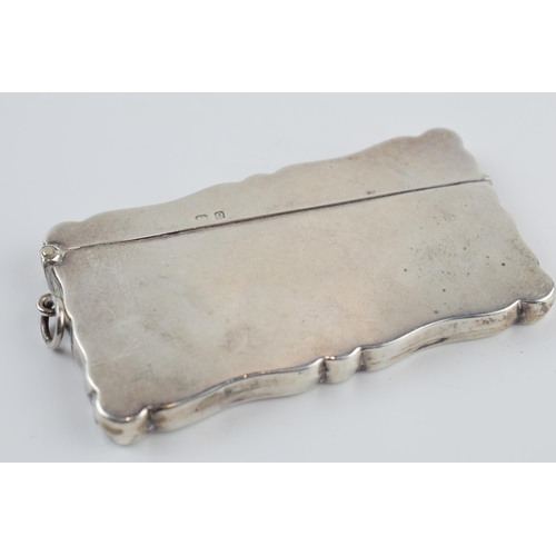 310J - Silver card case with hinged lid with musical notes decoration, Birmingham 1932, 50.4 grams, 9cm wid... 