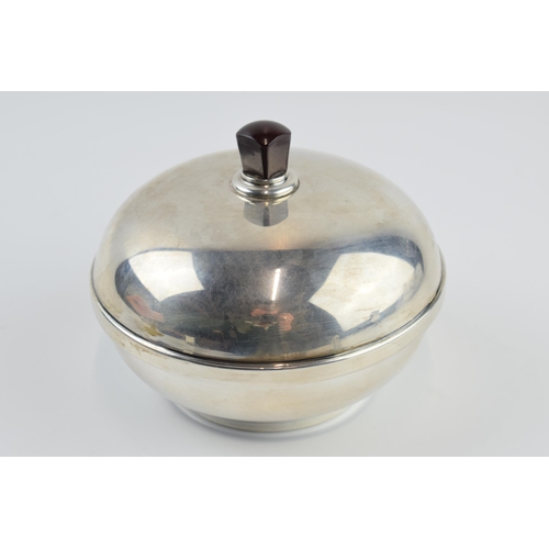 310K - Silver powder puff of domed form, with bakelite interior and handle, Birmingham 1932, gross weight 1... 