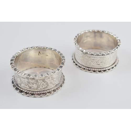 310M - Victorian pair of silver napkin rings, scroll effect border, Birmingham 1888, 40.3 grams.