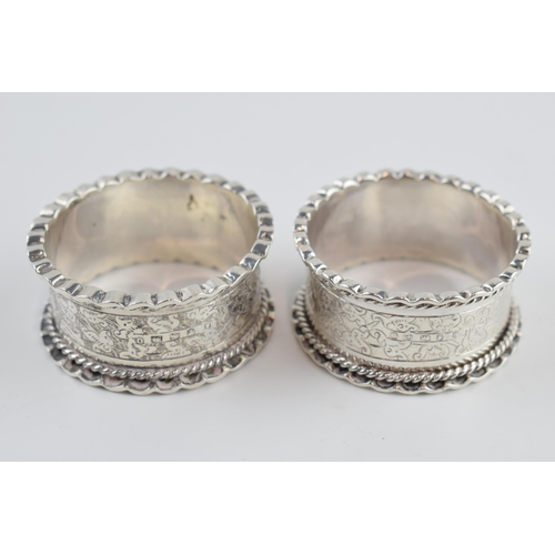 310M - Victorian pair of silver napkin rings, scroll effect border, Birmingham 1888, 40.3 grams.