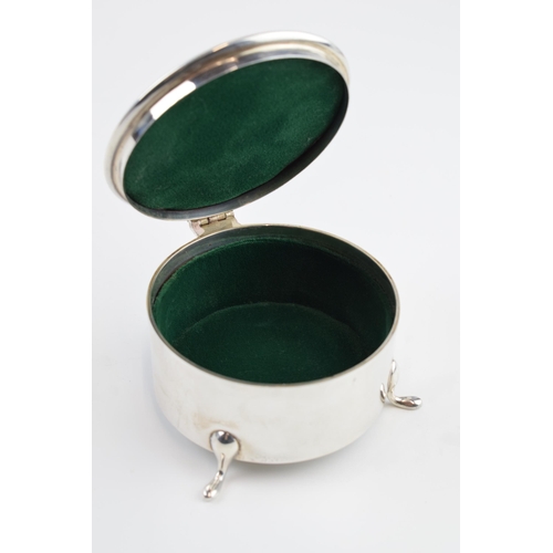 310S - Solid silver circular trinket box raised on 3 feet, with hinged lid and velvet interior, gross weigh... 