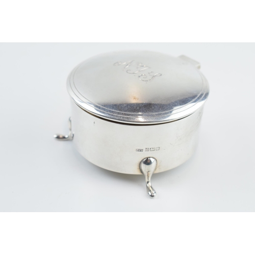 310S - Solid silver circular trinket box raised on 3 feet, with hinged lid and velvet interior, gross weigh... 