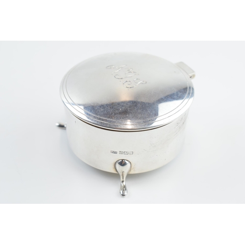 310S - Solid silver circular trinket box raised on 3 feet, with hinged lid and velvet interior, gross weigh... 