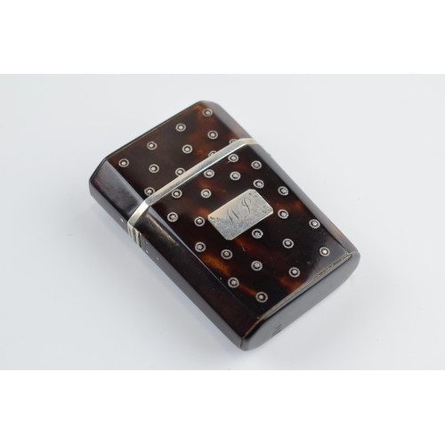 310U - Tortoiseshell box with silver inlaid decoration with hinged lid and compartments, 5.5cm tall.