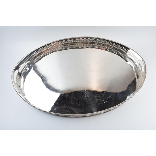 310W - Large Edwardian silver plated oval gallery tray with handles, 61cm wide.