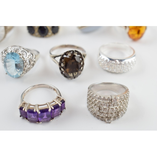 405A - A collection of silver dress rings of varying sizes and forms (9).