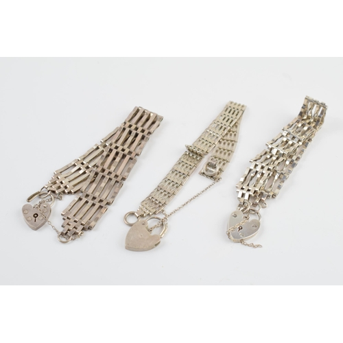 405E - A trio of silver gate bracelets, 46.5 grams (3).