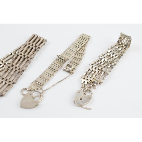 405E - A trio of silver gate bracelets, 46.5 grams (3).