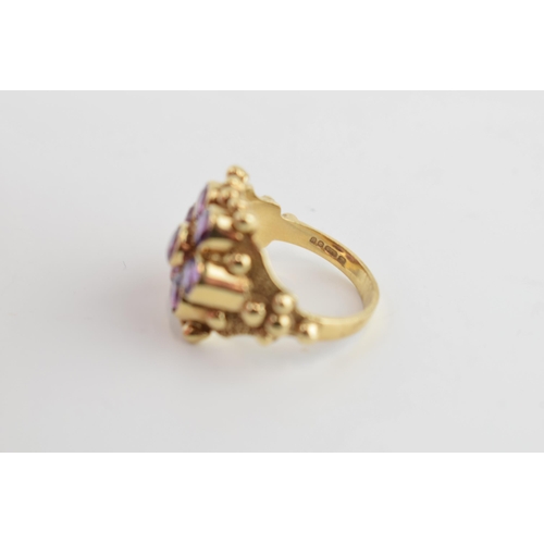 405L - 9ct gold ring set with amethyst stones, 5.0 grams, size O.