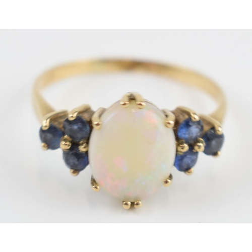 405M - 9ct gold opal and sapphire ring, 2.7 grams, size T.