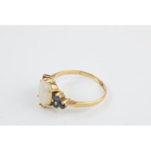 405M - 9ct gold opal and sapphire ring, 2.7 grams, size T.