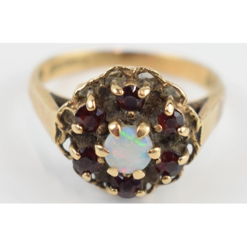 405O - 9ct gold ring set with opal and garnets, 3.4 grams, size N/O.