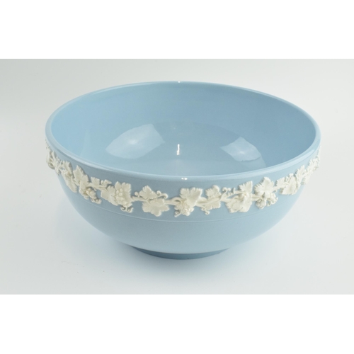 140 - Wedgwood Queensware white on blue large fruit bowl, 24cm diameter.