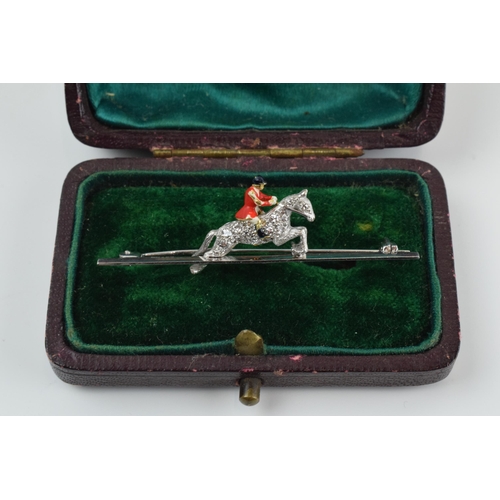 231 - 18ct white gold bar brooch with 18ct gold huntsman with enamelled decoration, set with old cut diamo... 