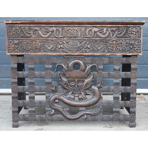 436 - Antique Chinese carved alter table with folding legs with carved figural decoration with character m... 