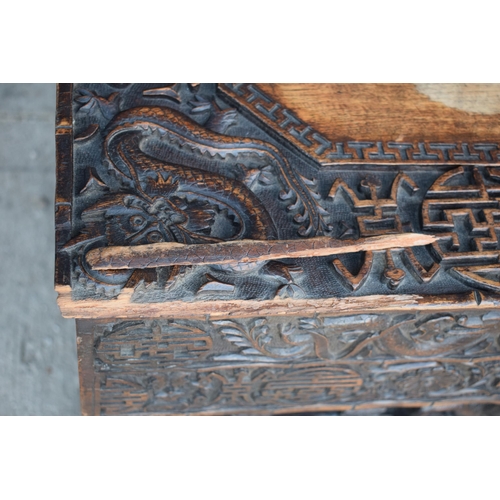 436 - Antique Chinese carved alter table with folding legs with carved figural decoration with character m... 