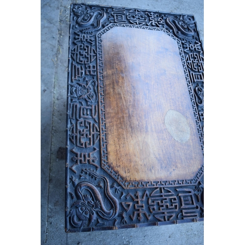 436 - Antique Chinese carved alter table with folding legs with carved figural decoration with character m... 