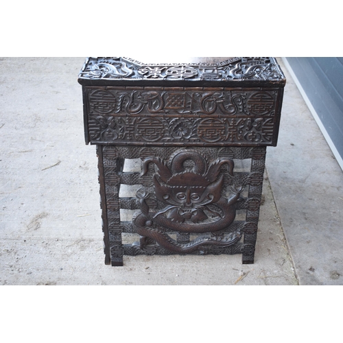 436 - Antique Chinese carved alter table with folding legs with carved figural decoration with character m... 