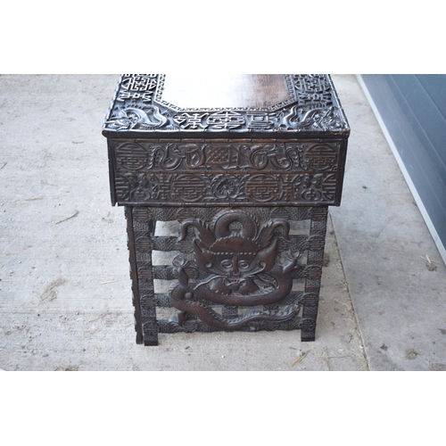 436 - Antique Chinese carved alter table with folding legs with carved figural decoration with character m... 