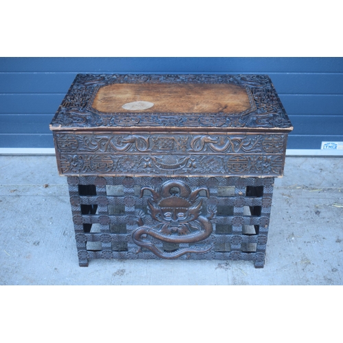 436 - Antique Chinese carved alter table with folding legs with carved figural decoration with character m... 