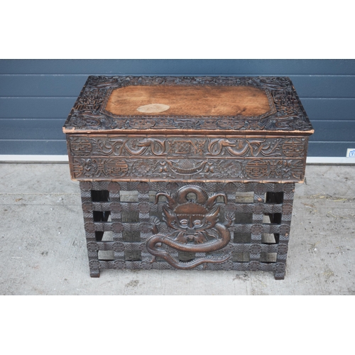 436 - Antique Chinese carved alter table with folding legs with carved figural decoration with character m... 