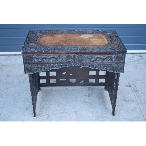 436 - Antique Chinese carved alter table with folding legs with carved figural decoration with character m... 