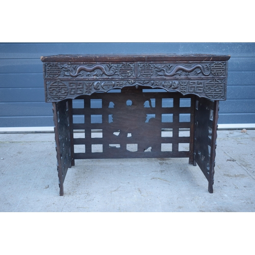 436 - Antique Chinese carved alter table with folding legs with carved figural decoration with character m... 