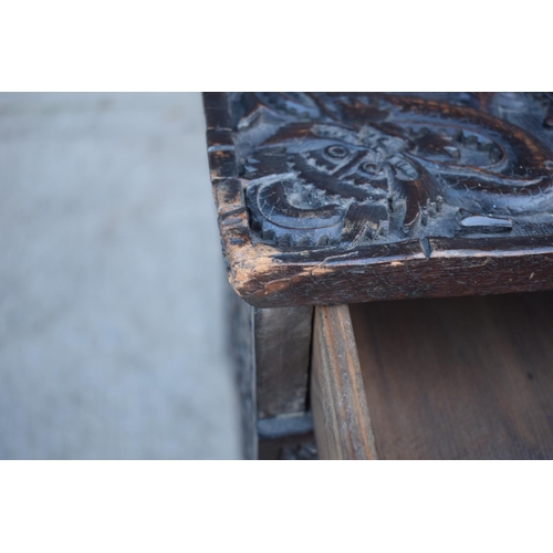 436 - Antique Chinese carved alter table with folding legs with carved figural decoration with character m... 