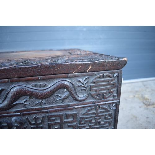 436 - Antique Chinese carved alter table with folding legs with carved figural decoration with character m... 