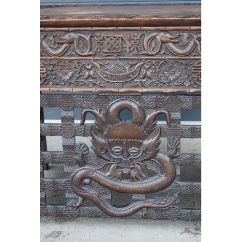 436 - Antique Chinese carved alter table with folding legs with carved figural decoration with character m... 