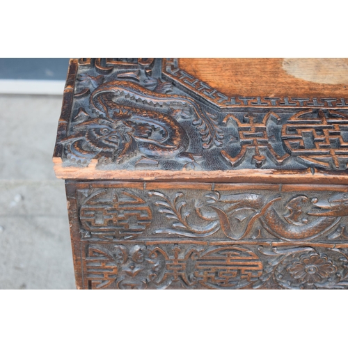 436 - Antique Chinese carved alter table with folding legs with carved figural decoration with character m... 