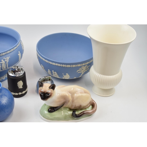 172 - Wedgwood Jasperware to include 2 large bowls, table lighters, Poole vase, Francesca cat and others (... 