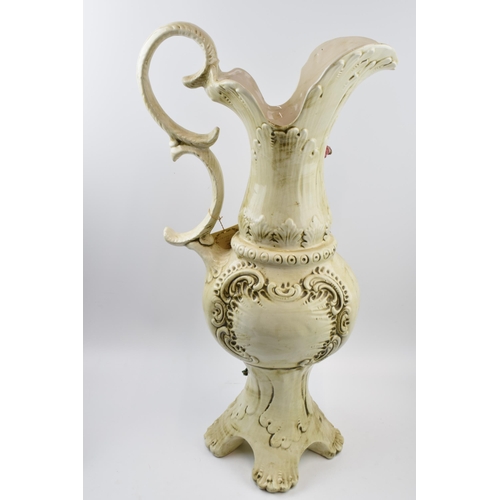 198 - Large Capo Di Monte floral jug with relief floral decoration, 66cm tall.