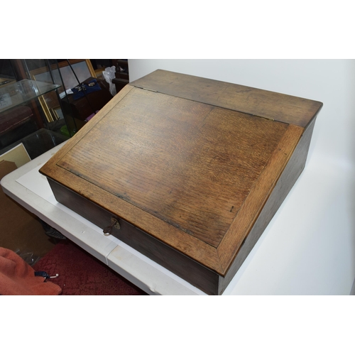 435 - 20th century oak writing slope / table top bureau with working lock, 61x57x25cm tall.