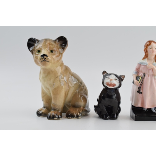 105 - Royal Doulton figures to include Lucky the cat, Dickens figures and an unmarked tiger (4).