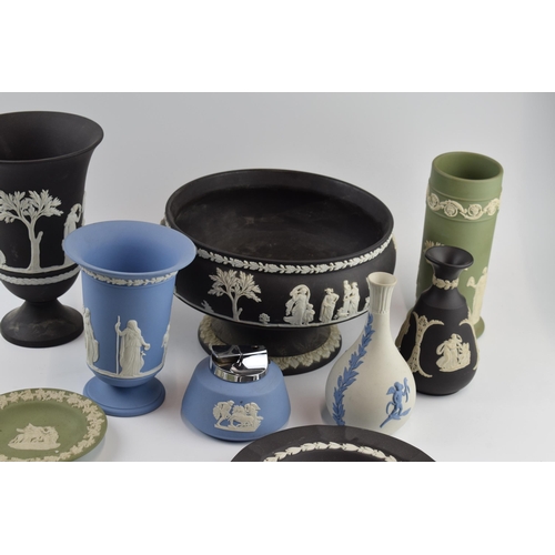 145 - Wedgwood Jasperware to include a black pedestal bowl, a lighter, a blue on white vase, vases and oth... 