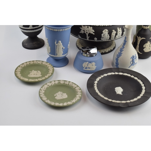 145 - Wedgwood Jasperware to include a black pedestal bowl, a lighter, a blue on white vase, vases and oth... 