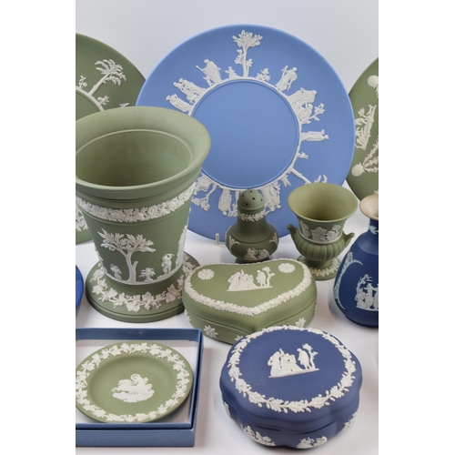 149 - Wedgwood Jasperware to include a large 7 inch vase, plates, vases and trinkets etc (15) .